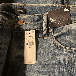 Mid Rise Medium Bootcut Jeans. Inseam Regular 32.5”